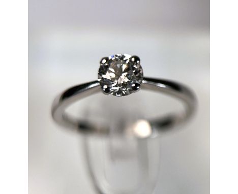 An 18ct hallmarked white gold lady's solitaire diamond ring, size H/I, in double presentation box with GIA certificate to con