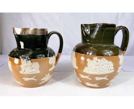 A Doulton Lambeth green and brown stoneware jug with relief decoration of hunting scenes, having hallmarked silver rim with d