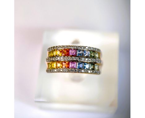 A 9 carat hallmarked dress ring with 3 bands of clear stones and 2 bands of rainbow coloured stones, 5.5gm, size R 