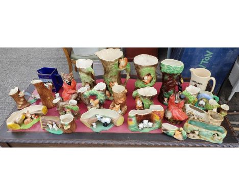 A pair of Staffordshire pottery foxes and a collection of ceramic animal Fauna jugs and vases including empty ceramic decante