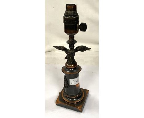 A bronzed table lamp in the form of eagle perched on column with squared base, height 29cm 