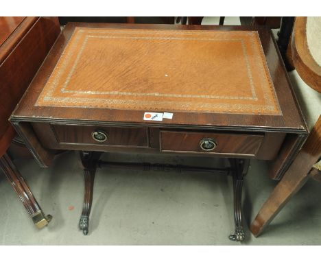 A pair of dwarf reproduction mahogany sofa/occasional tables with inset leather (one with small tear to leather) 