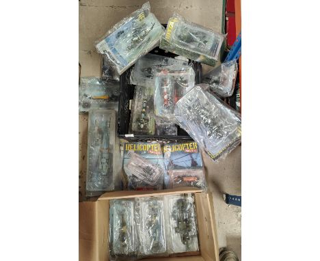 A large collection of diecast scale models of helicopters in blister packs etc. Amer.com and other collections including Mil 