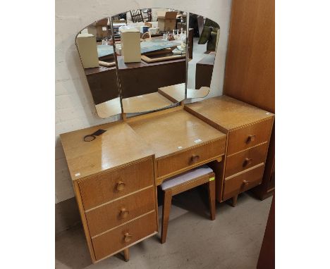 A mid 20th century light oak dressing table and matching double wardrobe 