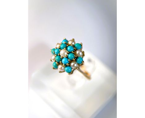 A 9 carat hallmarked gold ring with seed pearls and turquoise in tiered setting, 3.4gm, size N/M 