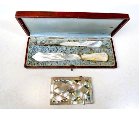 A mother of pearl and abalone shell decorated card case; a boxed mother of pearl letter opener and an ink pen handle. 
