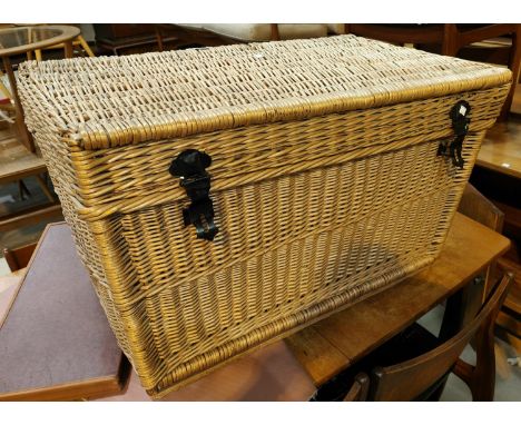 A large wicker linen hamper 
