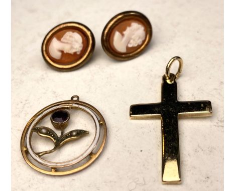 A 9 carat hallmarked gold cross; an open circular pendant with enamel inner circle and inset flower set with seed pearls and 