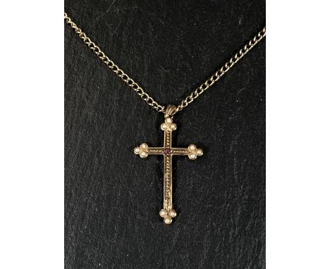 A seed pearl and ruby set yellow metal cross pendant stamped 375 on curb link chain stamped 375, 9gm 