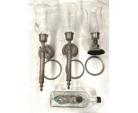 Two silvered metal candle wall lights with waisted glass shade; a similar table lamp; a vintage ship in a bottle 