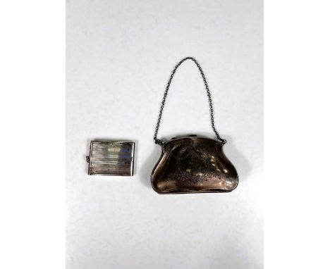 A hallmarked silver purse with chased ribbon and swag decoration, marks worn; an engine turned compact (gross weight 4.5oz) w