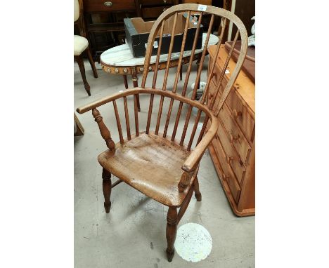 A 19th century elm and ash Windsor stick back armchair on turned legs 