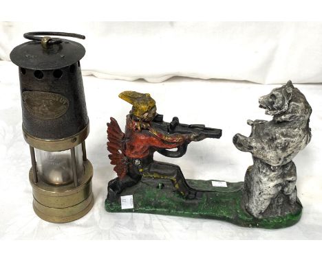 A miner's lamp by Ackroyd Best, a Victorian style cast iron novelty money box, man shooting bear 