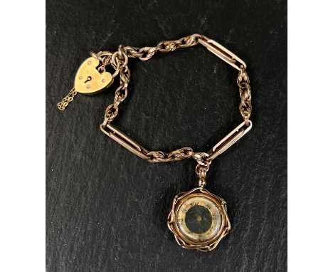 A trombone and triple link yellow metal bracelet stamped 375 with 9ct hallmarked gold heart lock with compass fob, stamped 9c