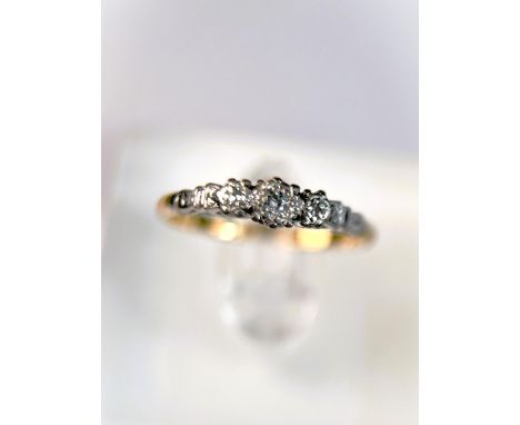 An 18 carat hallmarked gold dress ring with 3 illusion set diamonds in platinum surround, 2.5gm, size N 