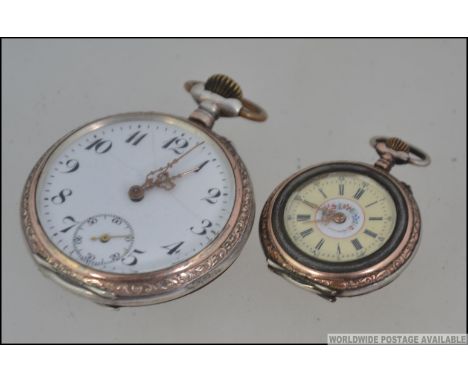 A silver and gold plated continental pocket watch marked to the inner case for Remontoir Cylindre 6 Rubis. Open faced with cr