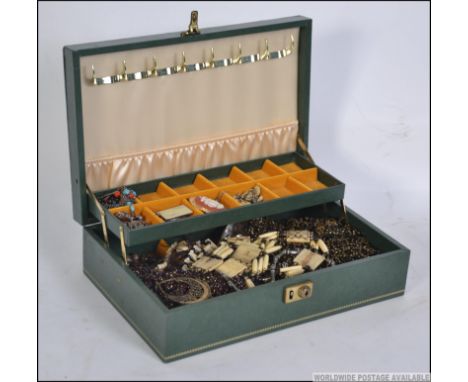 1980's green leatherette jewellery casket filled with mixed costume jewellery to include, 1 watch , 2 bone necklaces amongst 