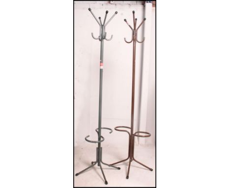 A pair of 1970's painted metal hat - coat stands, one brown, the other grey both with finals to hook and feet ends