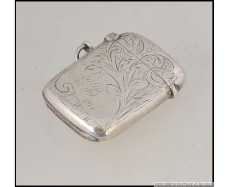 A silver hallmarked vesta case with rococo chase decoration  by William Hair Haseler, Birmingham 1913. 25.6g H4cm