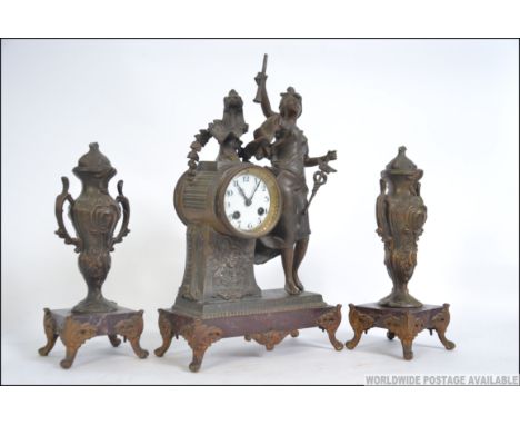 A 19th century French 3 piece marble and spelter clock garniture. The 8 day movement striking on a bell with enamel face and 