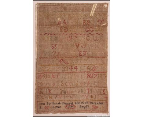A framed and glazed George III era needlepoint numerals and alphabet sampler. With the inscription to the bottom ' Done by Sa