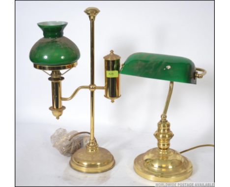 A 20th century antique style bankers lamp with green glass shade together with a brass and green glass coaching lamp H52cm