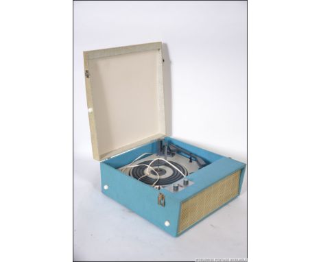 A vintage two tone vinyl covered four speed portable record player by Fidelity having a four speed BSR record deck, single sp