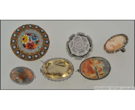 A collection of ladies silver brooches to include cameo set, agate stone set oval and cabochon examples, citrine stone set, V