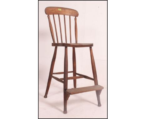 A stunning early 20th century school teachers spindle back high Stool / Chair, constructed from elm raised on tapering legs u