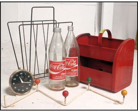 A collection of retro items to include atomic coat rack, tin dolly, retro Coca Cola bottles etc. Measures: 40cms high x 30cms