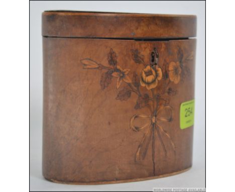 A George III satinwood and marquetry tea caddy, of oval form having  marquetry inlay decoration with a hinged lid having cent