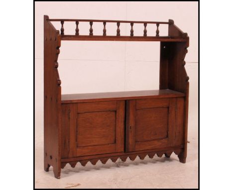 A Victorian mahogany hanging bookcase cabinet having twin cupboard doors with open shelf atop. Measures: 60cms high x 60cms w