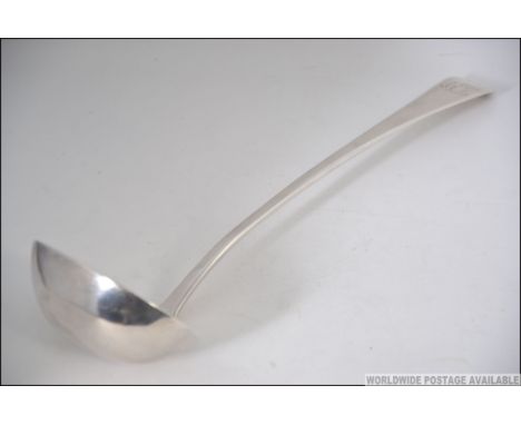 A large George III silver hallmarked ladle having London assay marks, date letter for 1807 and makers marks for Richard Cross