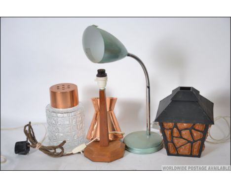 A vintage 1970's goose neck anglepoise desk lamp together with a collection of retro lamps including a plastic lantern shade.