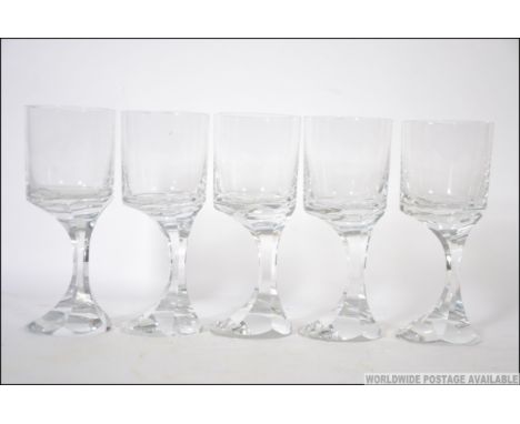 A set of 5 Baccarat France heavy lead crystal wine glasses having offset stems on terraced bases. Together with a set of 10 B