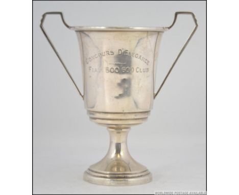 A silver hallmarked twin handled trophy bearing the inscription ' CONCOURS D'ELEGANCE FIAT 500 / 600 CLUB '  bearing Birmingh