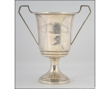 A silver hallmarked twin handled trophy bearing the inscription ' CONCOURS D'ELEGANCE FIAT 500 / 600 CLUB '  bearing Birmingh