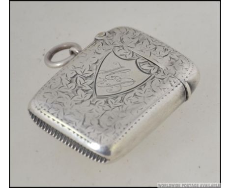 A late Victorian silver hallmarked vesta case with rococo chase decoration  by Minshull & Latimer,  Birmingham 1901. 18.8g H4