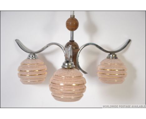 A set  of retro mid century three branch chandelier light fittings, having frosted glass shades