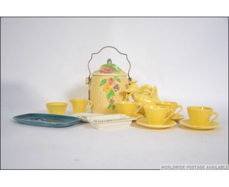A Wade Heath Walt Disney Licensed  childs tea service complete with the teapot together with a Wadeheath biscuit barrel and 3