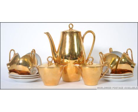 A 20th century continental ceramic gilt lustre tea service of Bareether - Bavaria comprising teapot, cups, saucers plates etc