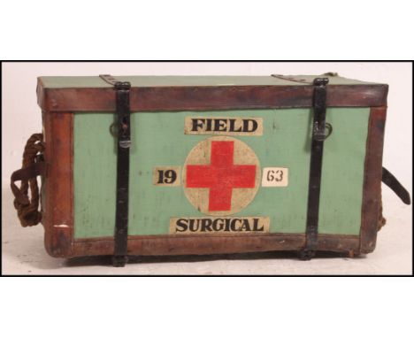 A rare world war one field surgeons military whicker and leather hamper trunk. Canvas bound with painted red cross and dates 