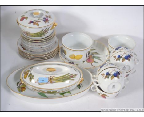 A Royal Worcester Evesham pattern dinner service comprising, plates, side plates, serving dishes ( as illustrated )