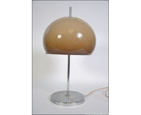 A modernist 1970's retro circular chrome based table lamp with opaque mushroom glass shade in the manner of Guzzuni. Measure: