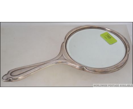 A silver hallmarked dressing table mirror by J Collyer Ltd, Birmingham 1947. Weight 424.3g L30cm