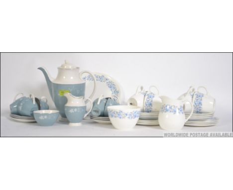 A Wedgwood Petra pattern part tea service. Comprising, cups, saucers, plates sugar bowl and creamer together with a Royal Dou