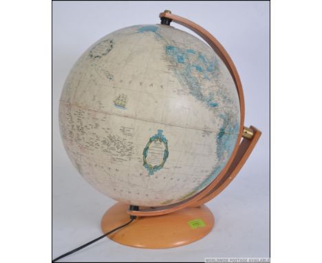 A good quality desk top globe raised on a wooden swivel mount and plinth. Makers Italian Nova Rico Heritage Collection. Measu