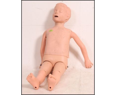 A 20th century first aid resuscitation doll being well articulated and ideal as shop display - point of sale. Measure: 107cms