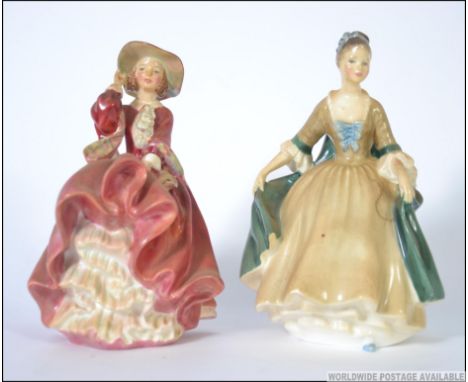 A Royal Doulton figurine entitled  Top O' The Hill  RD No 822821 / HN1834 together with another Elegance  HN2264. Measures: 2