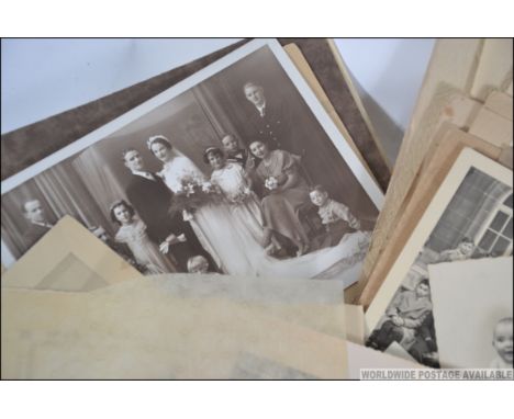 A collection of early to mid 20th century French photographs and negatives to include portrait, holiday, School photos etc